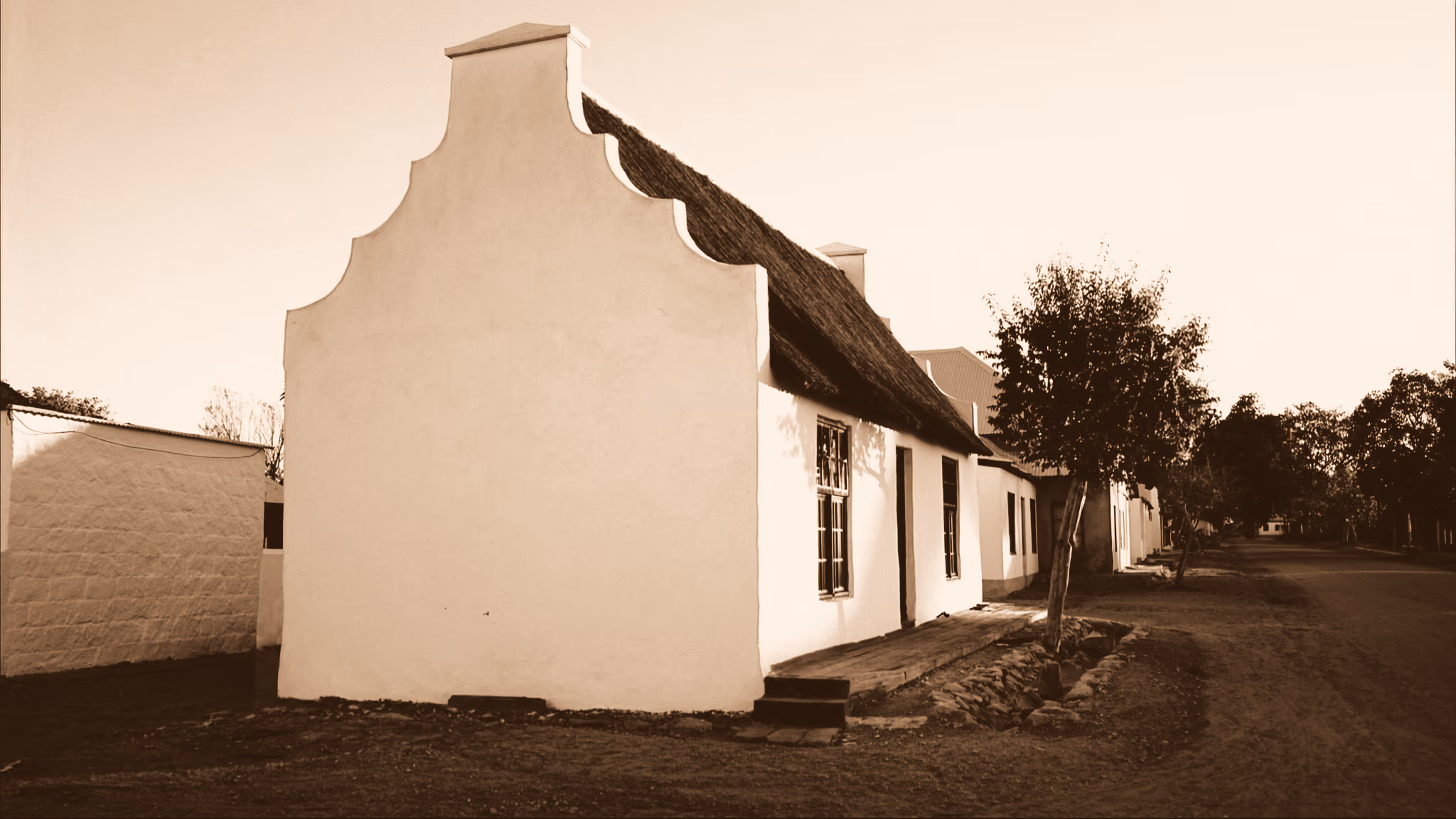 A whitewashed Cape Dutch gable on a Prince Albert village street