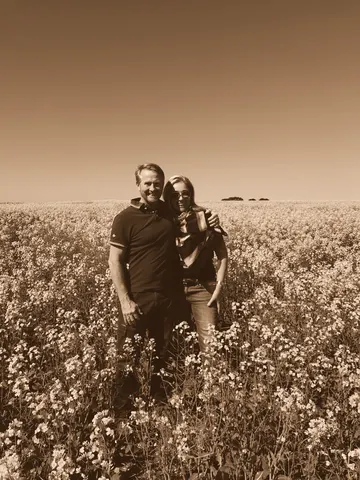 Standing chest-deep in a flowering field