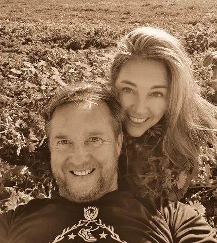 A selfie among open daisies on a hillside
